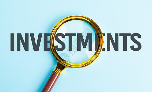 成功的商业投资 投资搜索概念 文本上的放大镜-投资图片