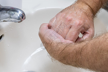 人手在盆地里洗手男性医学医疗洗涤护理洁净浴室泡沫皮肤肥皂图片