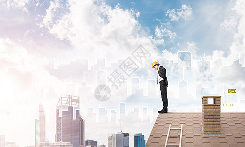工程师男子站在屋顶上向下看 混合媒体图片