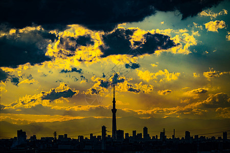 日落时包裹的东京天空树和东京市风景阴影街景观光景点橙子建筑群景观旅游太阳蓝天图片