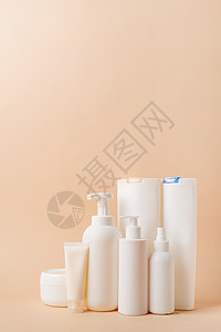 米色自然色背景化妆品用白色空白包装管和容器组 模型设计 生态友好塑料奶油洗剂卫生品牌推广产品护理小样洗发水图片