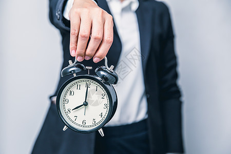 商业界人士有时钟时间显示需警告的延误时间 紧急或加快工作构想;图片