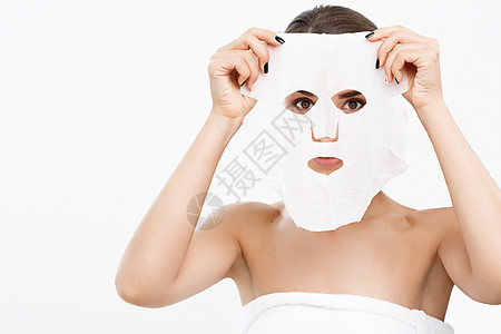 美容皮肤护理概念     美丽的高加索妇女 用纸巾遮盖脸部白色背景滋润柔软度女性女士女孩休息化妆品面具枕头治疗图片