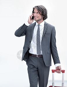 成功的商务人士 与行李 在电话交谈的电话旅行人士管理人员公司游客经理概念男性商务生意人图片