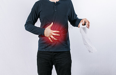 有胃病的人拿着卫生纸 有卫生纸的人在孤立的背景下有胃病 有消化和腹泻问题的人的概念图片
