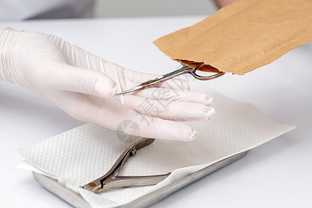 修美术手拿指甲工具安全消毒手套美甲沙龙卫生程序剪刀手术人手图片