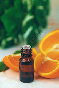 小瓶子里有橙色基本油 有选择性的焦点横幅疗法香味治疗身体果味化妆品香气香水橙子图片