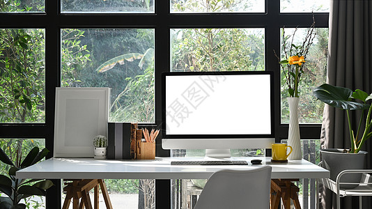 电脑Pc 空的图片框和白色桌子上的陶瓷工厂图片