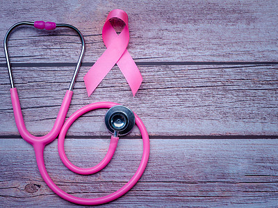 以木制餐桌陈年风格制作的粉色丝带和听诊器 乳癌符号 保健概念癌症疾病考试幸存者乳腺癌国家诊断女性斗争药品图片