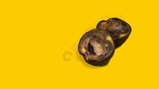 腐烂的鳄梨不能被吃掉垃圾水果饮食热带霉菌黄色食物背景蔬菜模具图片
