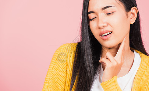 亚洲美丽的年轻亚洲女人有下巴疼痛淋巴结炎牙疼女士甲状腺脖子女孩按摩感染痛苦宽慰图片