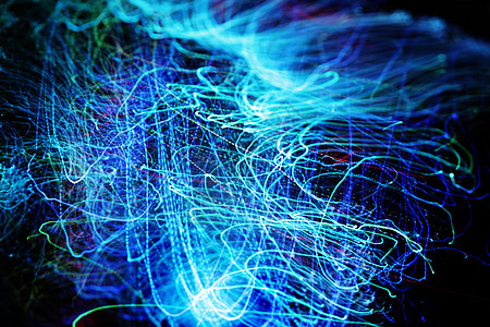 在 LED 霓虹蓝光中长时间曝光光纤光缆 具有螺旋运动效果的光学器件 适用于快速数据 网络和互联网使用 黑暗背景下电线的数字摘要图片