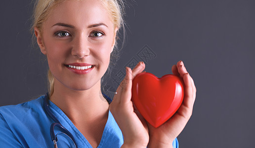 年轻女医生 有心结的听诊器护士药品卫生实验室疾病女性外科职员工人心脏病图片