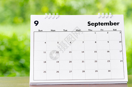 2022年9月 组织者日历台在木制桌子上就自然背景进行规划和提醒时间表规划师旅行会议议程数字日程商业工作假期图片