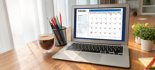 计算机软件应用日历 用于Modish计划时间表规划日程活动备忘录商务团队桌子男人会议工作笔记本图片