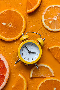 时钟和柑橘夏季时间概念 有选择的焦点橙子手表蓝色商业果汁柠檬柚子饮食小时幸福图片