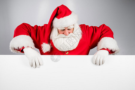 圣诞老人在白背景广告后面偷看 圣诞快乐 圣诞快乐问候语假期戏服传统手套男人木板男性庆典帽子图片
