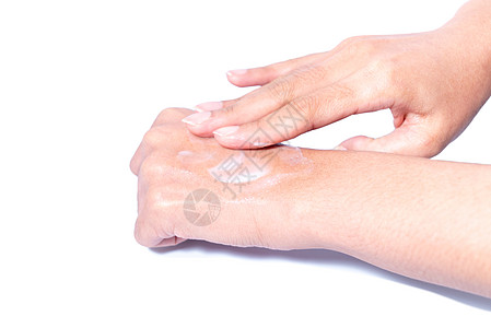 近身女郎手头上涂了保护奶油柔软度温泉手臂成人拇指瓶子皮肤科护理润肤卫生图片