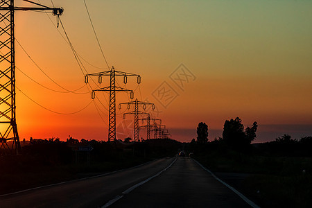 日落时电塔 电压高架基础设施车站危险天空电缆变压器金属工程力量太阳图片