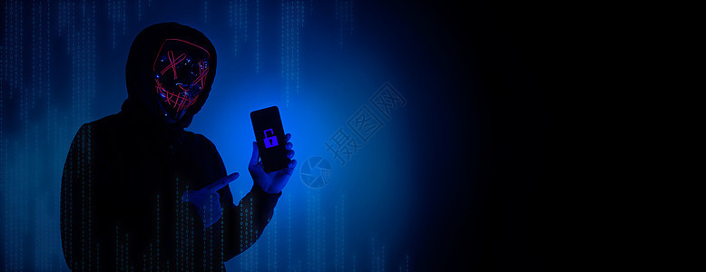 数字安全概念 隐形黑客戴着智能手机面具的匿名黑客手指电话资料人士检测商业电脑技术机密网络图片