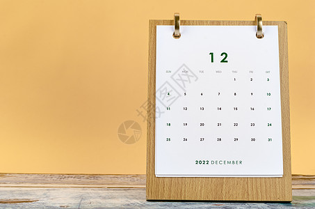 关于黄色背景的2022年12月每月表格日历 日期为2022年会议组织文具办公用品季节家庭生活活动假期英语桌子图片