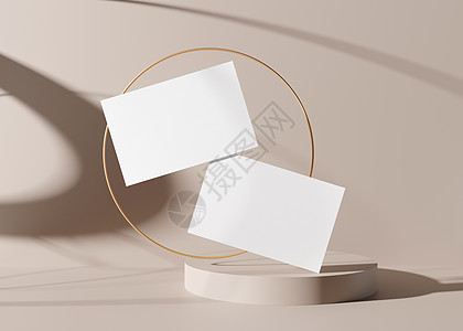 空白的白色名片与奶油色背景上的金戒指 品牌标识的样机 两张牌显示双方 图形设计师的模板 自由空间 复制空间 3D 渲染图片