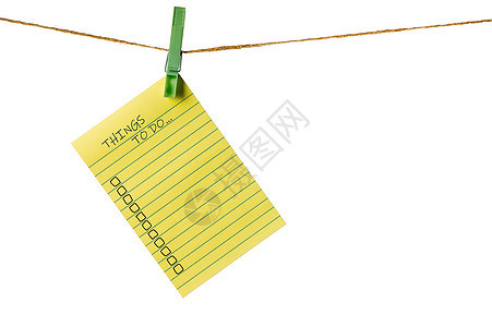 新年新目标 白线上的黄色粘贴笔记纸 要做列表空白绳索卡片衣绳洗衣店衣夹别针细绳商业木板图片