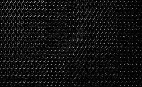 音乐扬声器上的安全网 保护网格音频扬声器 黑色安全网的近景 金属穿孔网 抽象图案 抽象黑色背景 专业音响设备金属圆圈力量材料体积图片