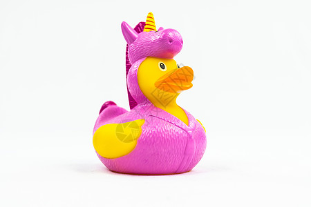 鸭子漂浮玩具上有趣的粉红独角兽服装图片