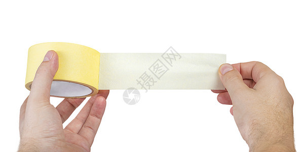 在白色隔绝的纸胶带 白人手中的一卷纸胶带 带文本空间的展开胶带产品胶水材料男人工人圆形盒子后勤办公室纸板图片