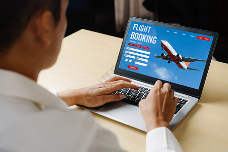 在线航班预订网站提供现代订票系统 n电脑空气服务男人商业商务旅游药片办公室飞机图片