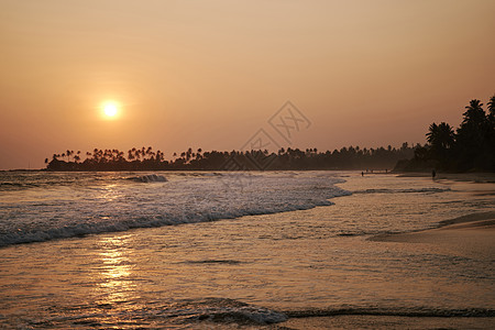 斯里兰卡的海洋日落斯里兰卡天空橙子太阳阳光风暴棕榈旅游天堂蓝色异国图片