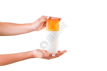 女性手握奶油液瓶 单独隔离女孩在白色背景上提供化妆品制品管子凝胶手臂护理屏幕润肤橙子展示洗剂产品图片