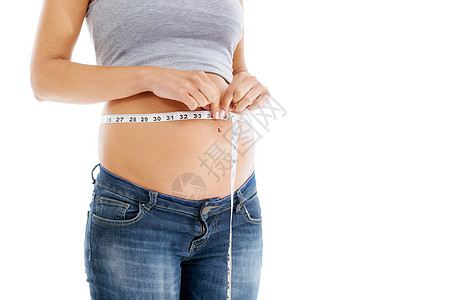 怀孕 在工作室测量胶带和胃 因为女性在模型上检查生长 发育和健康 白色背景下的腹部 健康和孕妇自我护理 饮食和健康进步图片