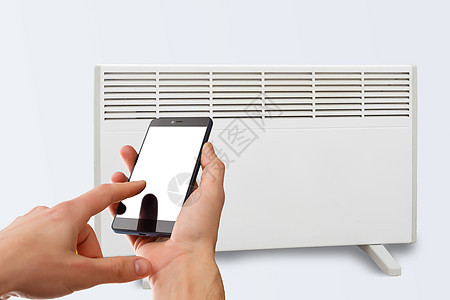 通过手机应用程序控制智能加热器对流器 带智能供暖系统的智能家居 电动面板加热概念图片