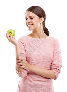 健康 食物和微笑与苹果一起为营养 饮食和减肥选择的女人 纤维 护理和维生素 在工作室里 女孩吃水果的孤立面孔是为了健康 有机和天图片