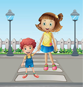 一个小孩和一个女孩 穿过行人路口图片