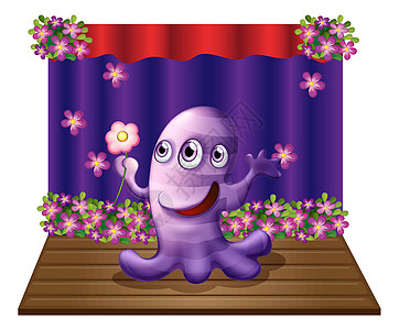 一个三眼紫色怪物 站在舞台的中央图片