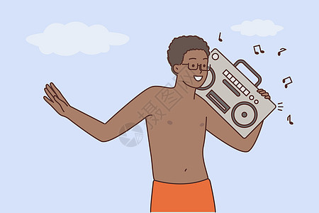 快乐的黑人在立体音响上享受音乐图片