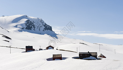 冬季奇幻乐园 季节性的 晴天 山脉 场景 小屋 蓝色的 季节图片