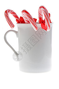 孤立的白杯中的甘蔗 有条纹的 曲线 圣诞节 庆典 食物 糖果手杖图片