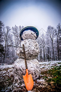 雪雪人 户外 树叶 问候语 脸 滚雪球 雕塑 薄片背景图片
