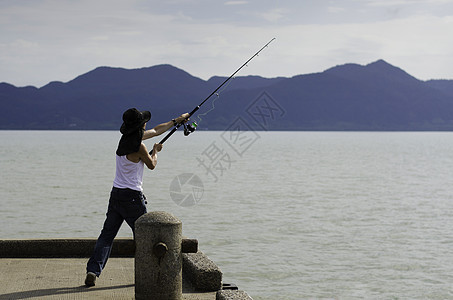 捕鱼渔民在海上钓鱼 杆 老了 拖钓 蓝色的 卷轴 闲暇图片