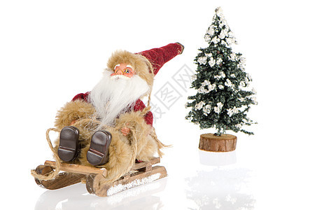 圣诞老人骑雪橇的微型 喜庆的 驯鹿 展示 欢呼图片