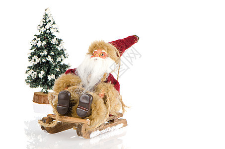 圣诞老人骑雪橇的微型 展示 概念上的 季节 驯鹿 冰图片