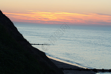 日落 晚上 反射 海岸 美丽 海浪 云 蓝色的 晴天 热的图片