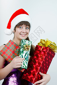 穿着圣诞礼帽的漂亮女孩 带礼物盒图片