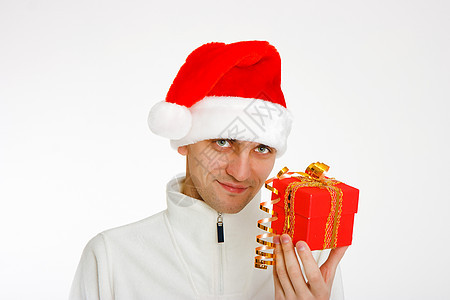 戴着圣诞老人帽子的年轻人拿着礼物 男性 弓图片