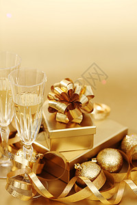 金丝带圣诞节背景 香槟酒 玻璃 奢华 浪漫的 季节 嘶嘶声 干杯 吐司背景