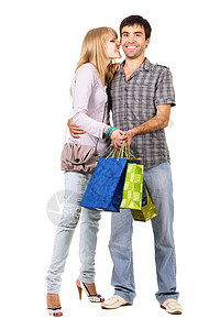 带购物袋的美美年轻夫妇 夫妻 男人 礼物 女士 快乐图片